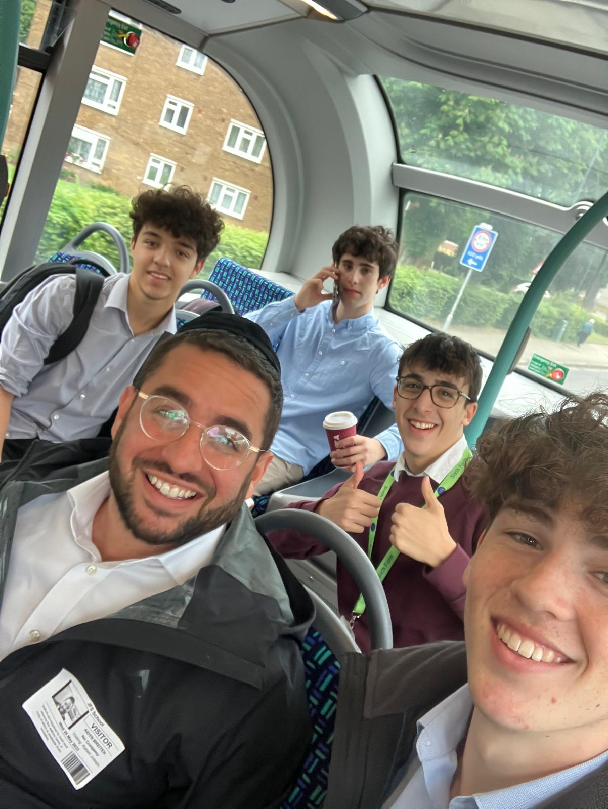Rabbi Aidyn with students on a bus trip