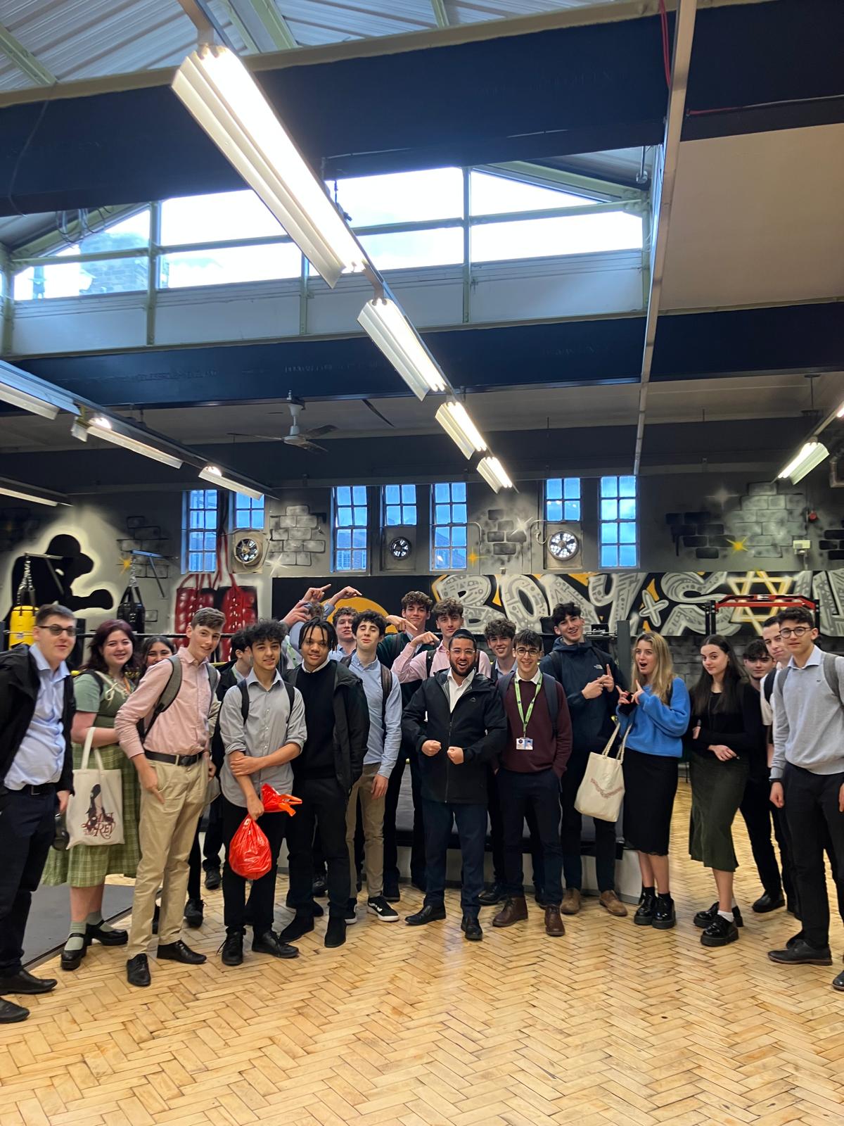 Rabbi Aidyn with a large group indoors