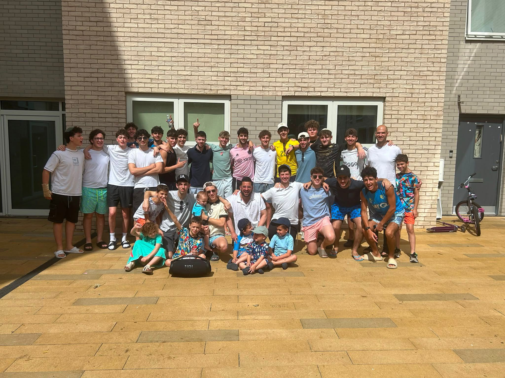 A large group outdoors on a summer programme