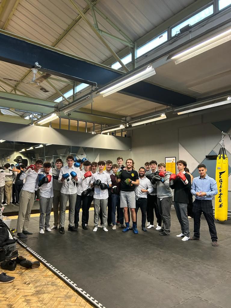 Students gathered together in a sports hall